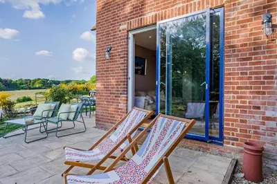 a group of chairs sitting on a patio at 2 Bed in Holbrook oc-31111 in Holbrook