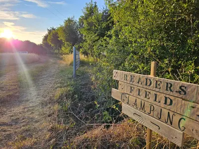 a sign that reads wizardsfield camping on a field at Readers Field Glamping in Great Sampford