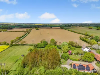 an aerial view of a field and a house at Cedar - Uk49525 in Saint Lawrence