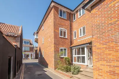 an empty street in an old brick building at 3 St Johns Court - Aldeburgh Coastal Cottages in Aldeburgh