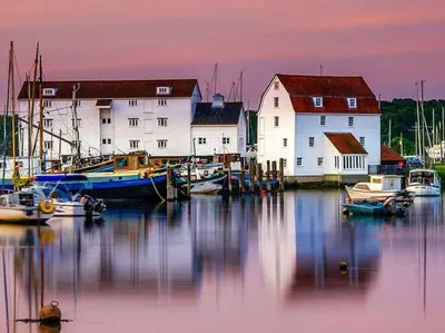 a group of boats are docked in a harbor at Blossom House in Woodbridge