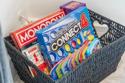 a basket filled with toothbrushes and toothpaste at Cozy accessible 2bd flat on Mill road with firepit for a lovely winters night in Cambridge