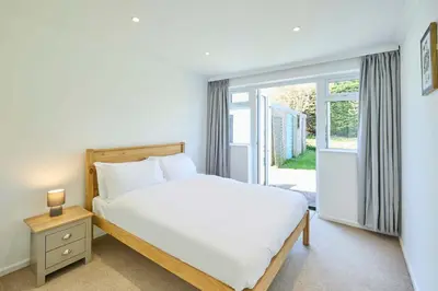 a bedroom with a white bed and a window at Host & Stay - Park View in Thetford