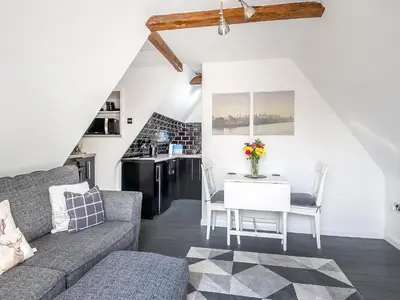 a living room with a couch and a table at Treetops - Uk49523 in Saint Lawrence