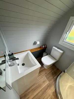 a bathroom with a white sink and a toilet at All Manor Of Events - Glamping Pods in Henley