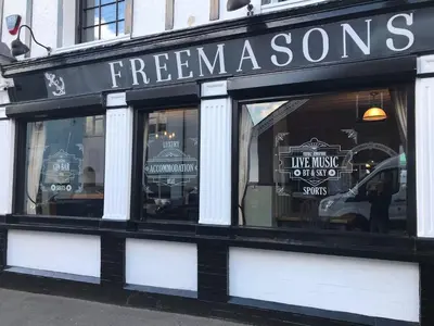 a store front with a sign that reads freeman sons at Sanctuary Rooms in Brightlingsea