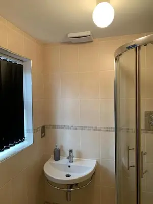 a bathroom with a sink and a shower at Two Bed Flat By The Beach No Parties No Events in Southend-on-Sea