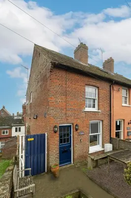 an old brick house with a blue door at 7 Coastguards Cottages - Aldeburgh Coastal Cottages in Aldeburgh