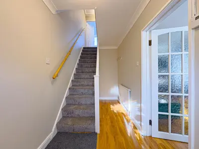 a staircase in a house with a window at Urban Ease Basildon in Basildon