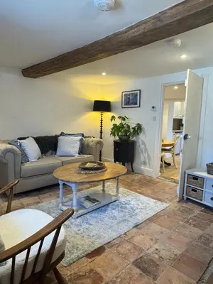 a living room with a couch and a table at 5 chapel lane Wymondham Norfolk in Wymondham