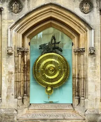 a large gold object in a glass window on a building at Cute and Spacious 1 Bed House by Station and River in Cambridge