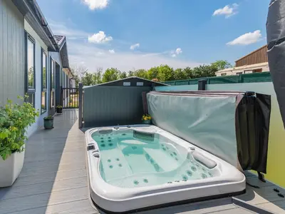 a hot tub on the balcony of a building at Sunnyfields in Cambridge