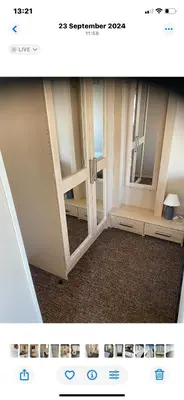 a picture of a room with a door and a mirror at Hadleigh Caravans at Seawick Clacton in Clacton-on-Sea