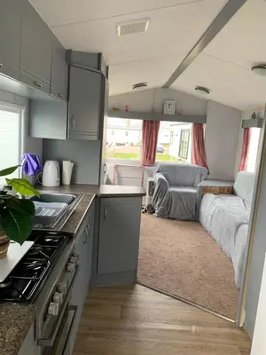 a kitchen and living room in a caravan at Seawick holiday park caravan in Saint Osyth