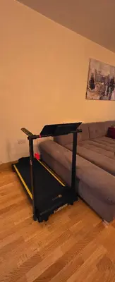 a living room with a couch and a table at 1 bed luxurious flat in Basildon
