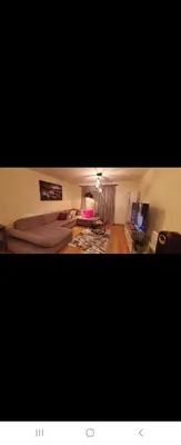 a living room with a bed and a television at 1 bed luxurious flat in Basildon