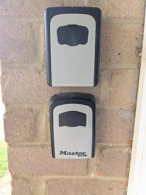 a brick wall with two white toasters on it at Cambridge House near Addenbrookes, station and parking! in Shelford