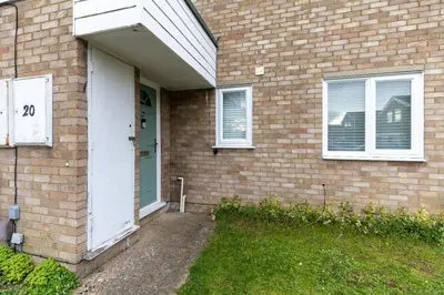 a brick house with a white door and windows at Cambridge House near Addenbrookes, station and parking! in Shelford