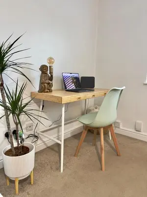 a desk with a laptop and a green chair at Long Stay Basildon Essex Business Contractors in Basildon