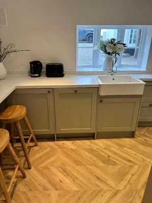 a kitchen with a sink and a counter top at Historic Retreat Near To Mersea Island in Peldon