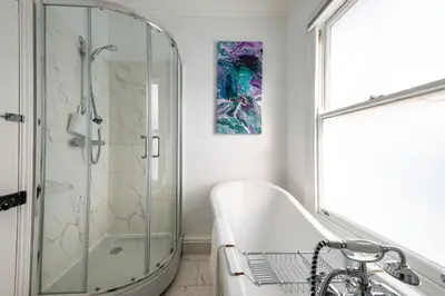 a bathroom with a shower and a tub and a sink at Elegant Period House in the Historic Heart of Cambridge - sleeps 12 in Cambridge