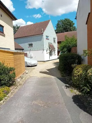 a driveway leading to a house with a garage at 'Ks' Yard in Great Dunmow