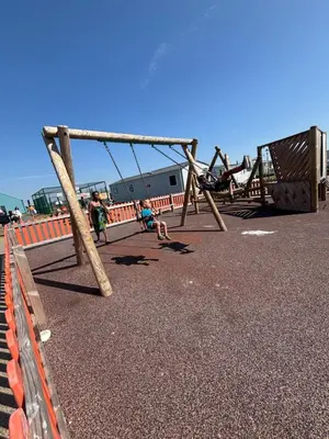 a childrens playground with a swing set at Singh&Leite Family RF10 in Jaywick Sands
