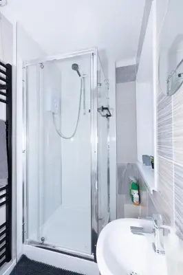 a bathroom with a shower and a sink at Urban Escape - Flat in Brandon