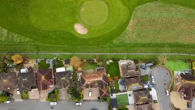 an overhead view of a yard with houses and a field at Relaxing Coastal Getaway Perfect for Families in Canvey Island