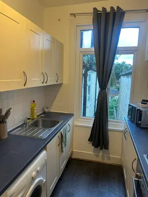 a kitchen with a sink and a window at The Retreat On Retreat Road in Southend-on-Sea