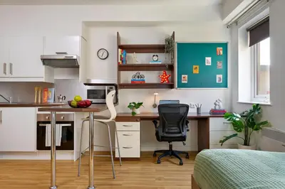 a small kitchen with a desk and a bed at For Students Only - The Maltings in Colchester in Colchester