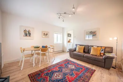 a living room with a couch and a table at 19BC, Aldeburgh in Aldeburgh