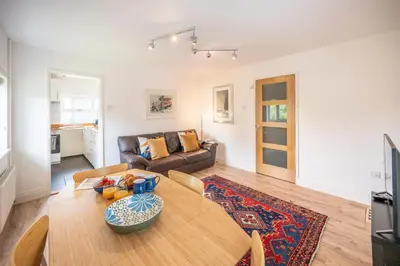 a living room with a table and a couch at 19BC, Aldeburgh in Aldeburgh