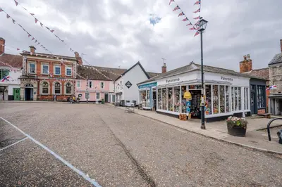 an empty street in a town with buildings at Market View, Framlingham in Framlingham