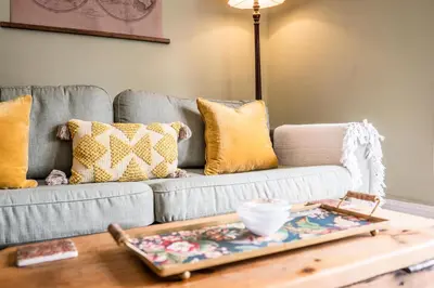 a living room with a couch and a coffee table at Market View, Framlingham in Framlingham