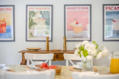 a dining room with a table and pictures on the wall at 4 Bed in Hartest oc-w32685 in Hartest