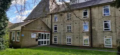 a large brick building with white doors and windows at Memorial University, Harlow Campus in Burnt Mill