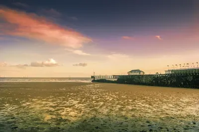 a pier on the beach near the water at Great 8 Berth Caravan With Unlimited Wi-Fi At Seawick Holiday Park, Ref 27213Sw in Clacton-on-Sea