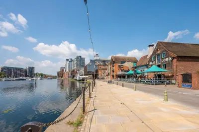 a city street with buildings and a river with buildings at Cotton Room, The Merchant House, Ipswich in Ipswich