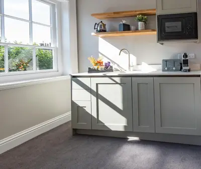 a kitchen with a sink and a window at Poets 24 in Ely