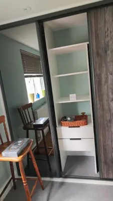 a room with a desk and a chair and a table at Crystalsspace in Braintree