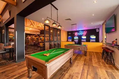 a billiard room with a pool table and a bar at Your Seaside Escape at St Osyth Modern caravan with decking and wifi and parking Nr to Clacton on Sea in Saint Osyth