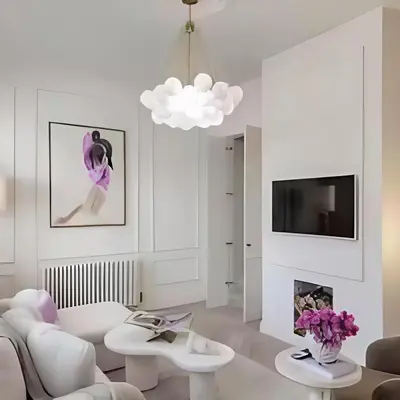 a living room with white furniture and a tv at Stunning house in the heart of Leigh-On-Sea in Leigh-on-Sea