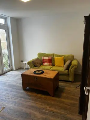 a living room with a couch and a coffee table at Southend Luxe Retreat in Southend-on-Sea