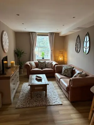a living room with two couches and a coffee table at Cosy central hideout in Ware