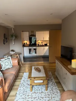 a living room with a couch and a coffee table at Cosy central hideout in Ware