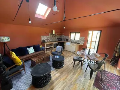 a living room with a couch and a table at Okovango Cabin in Holton