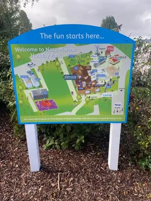 a sign for the fun starts here at a park at 2 Bedroom Mini Lodge near the beach in Walton-on-the-Naze