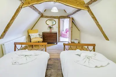 two beds in a room with a attic at 4 Bed in St. Nicholas South Elmham oc-o32397 in Saint Margaret