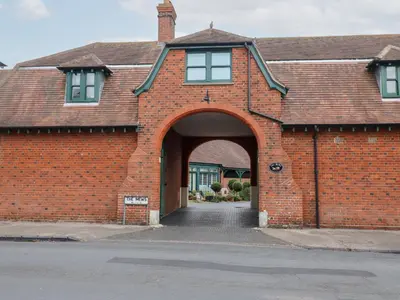 a red brick house with an archway at Old Felixstowe, Bath Road in Felixstowe